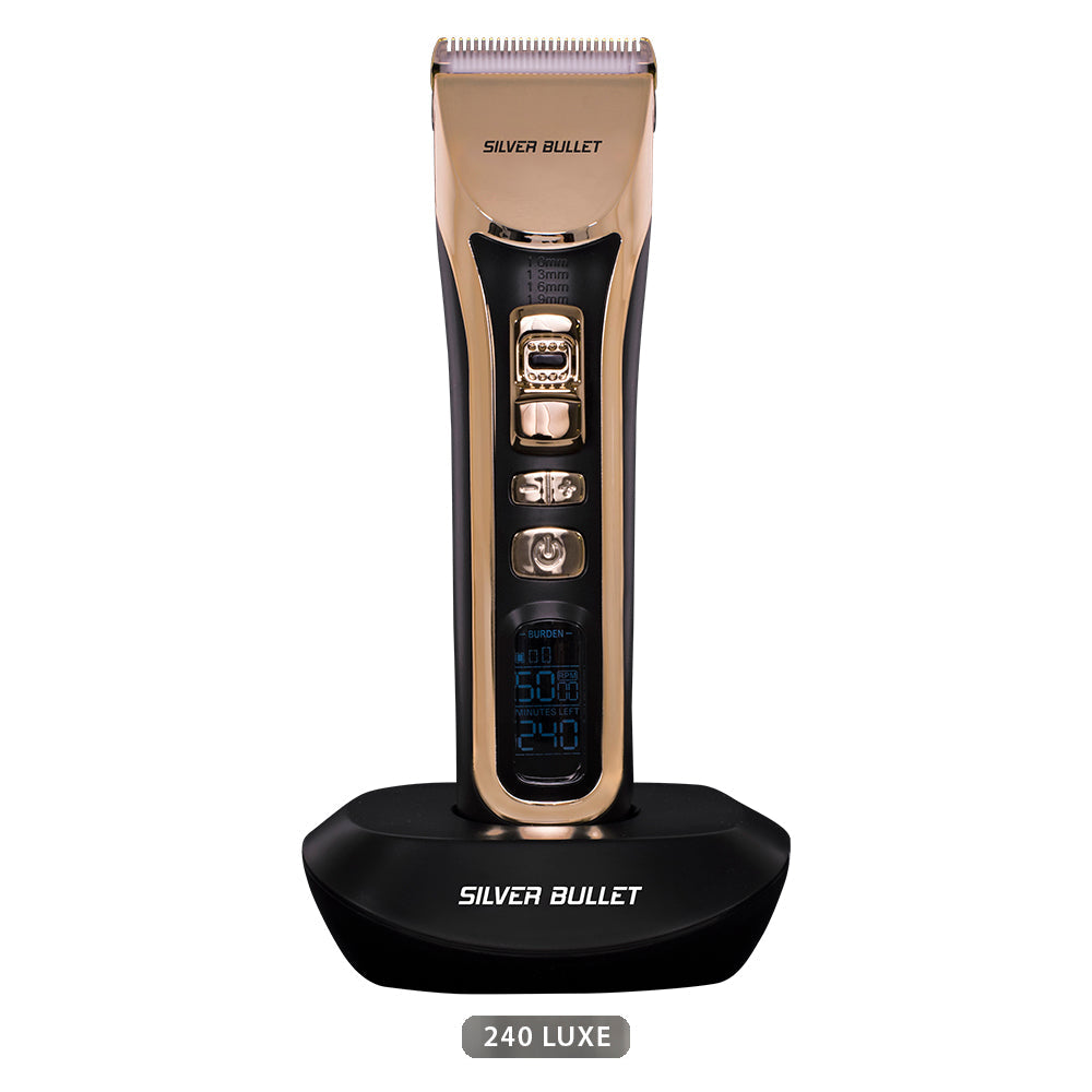 Gold-colored Silver Bullet Ceramic Pro 240 Luxe Hair Clipper with a digital display, shown on a stand.